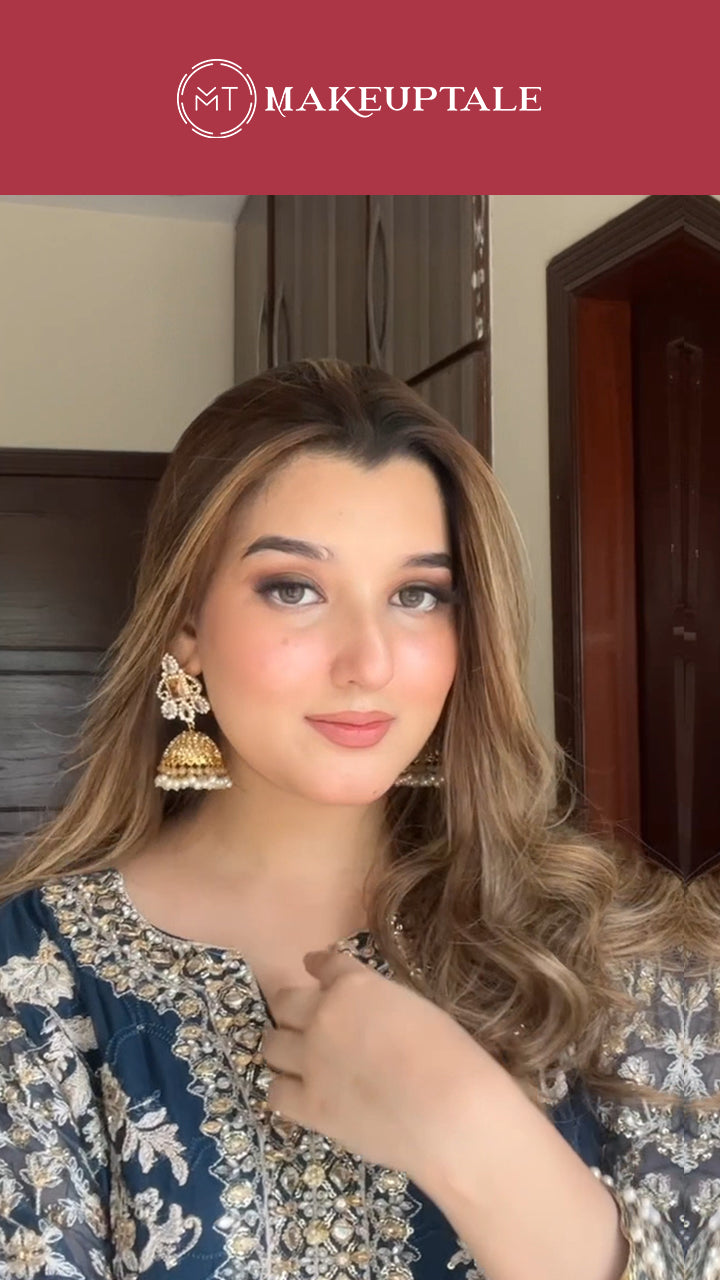 Woman in traditional outfit with decorative earrings in a room with wooden furniture. befor and after makeup look