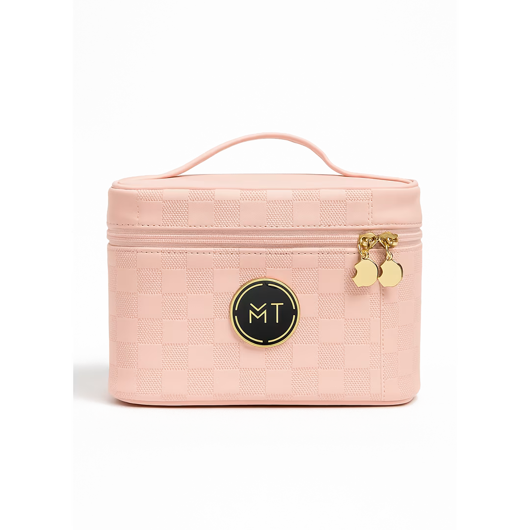 Pink cosmetic bag with gold accents on a white background
